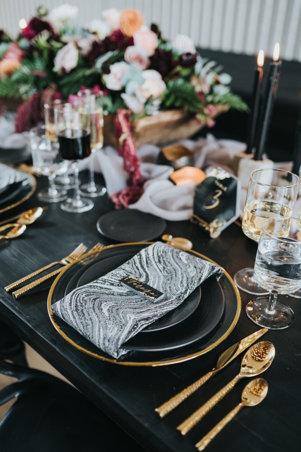 modern glam black gold and marbled wedding place setting