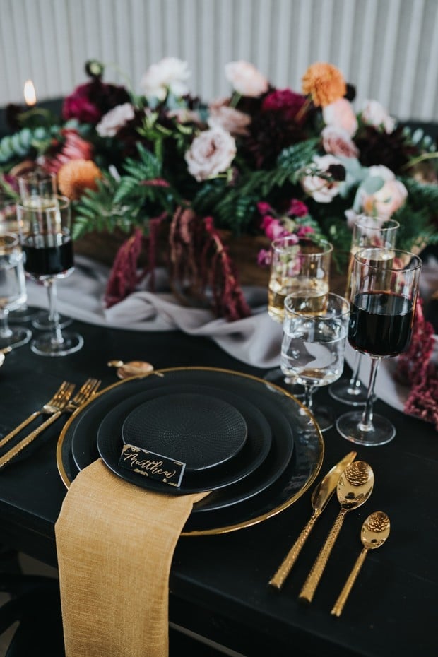 modern moody black and gold place setting