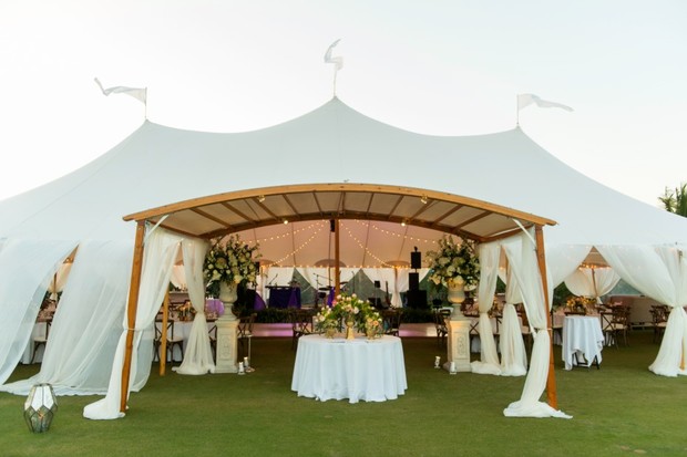 Elegant outdoor event setup with a large white tent