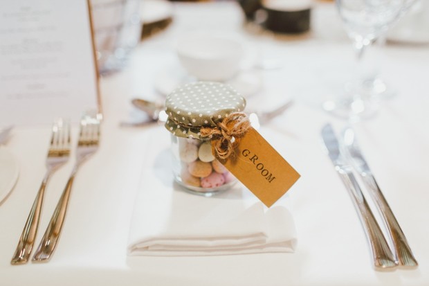 Wedding table setting with groom favor jar and cutlery