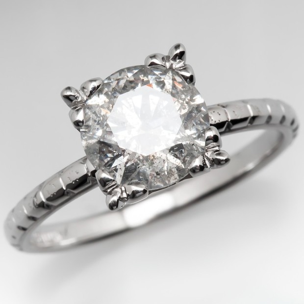 Elegant diamond engagement ring with ornate detailing
