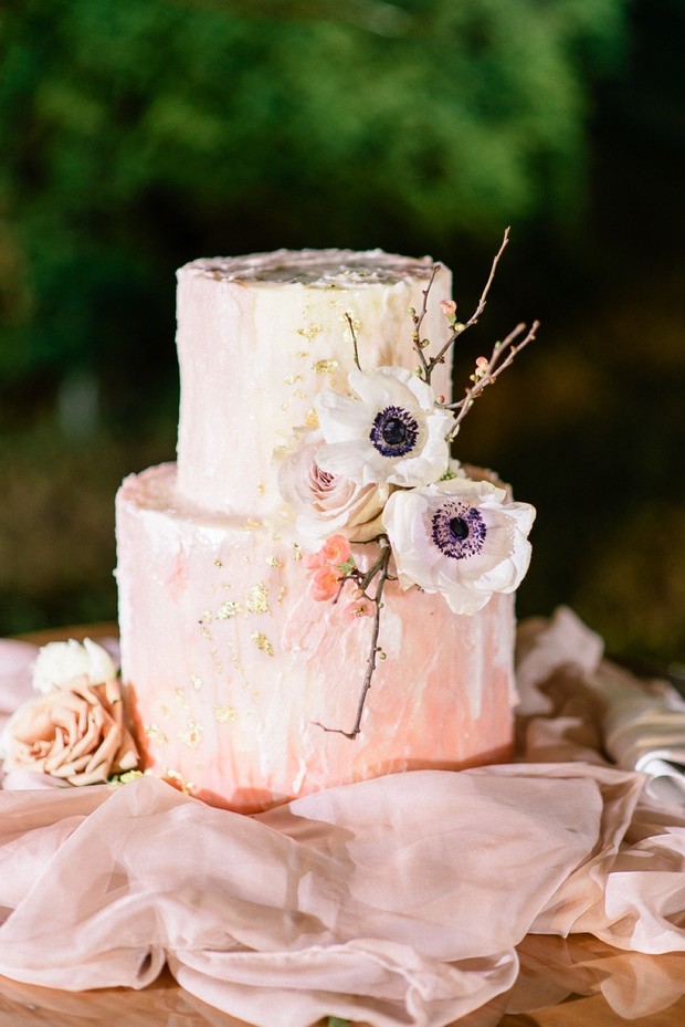 Two-tier wedding cake with flowers, elegant and romantic design