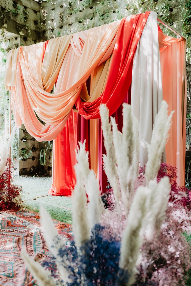 draped fabric wedding ceremony backdrop