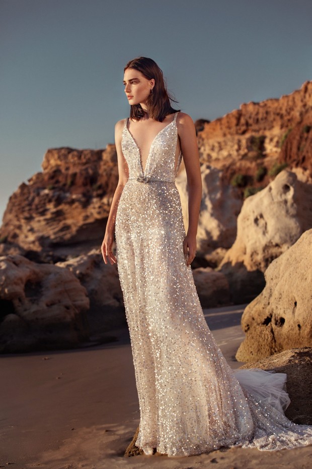 Bride in a sparkly wedding dress on a sandy beach