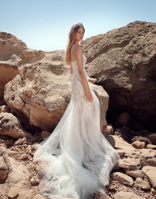Elegant bride in a stunning wedding dress, posing outdoors