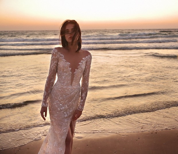 Woman in wedding dress on beach at sunset, elegant bridal style