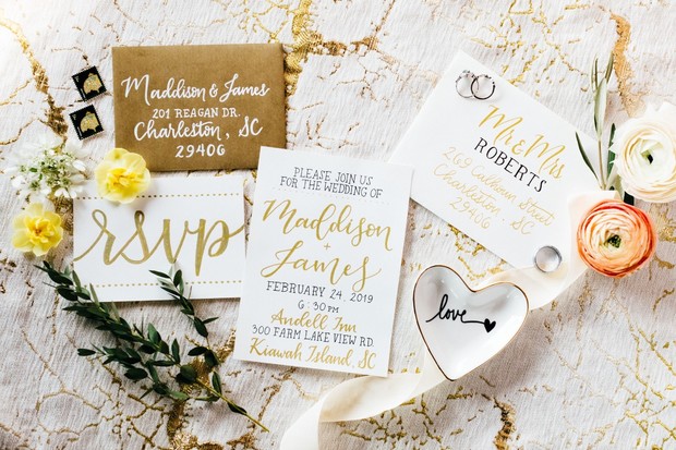 gold and white calligraphy wedding invitation suite