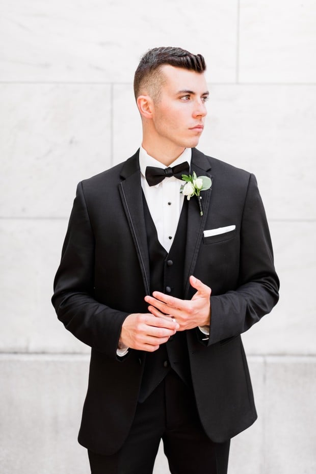 groom in three piece suit