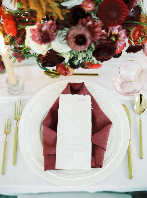 Wedding place setting in red and gold