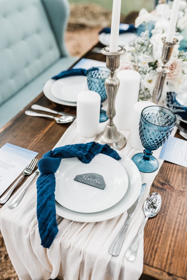 wedding place setting with blue accents