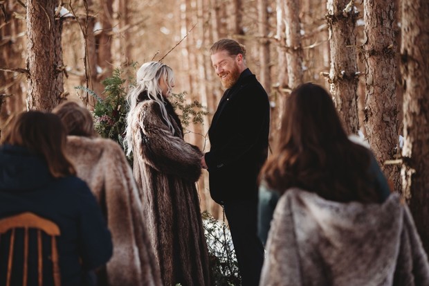 winter wonderland wedding ceremony in the woods
