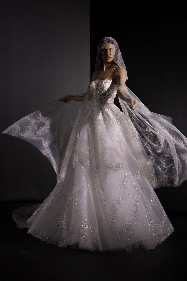 Elegant bride in a flowing gown with a veil