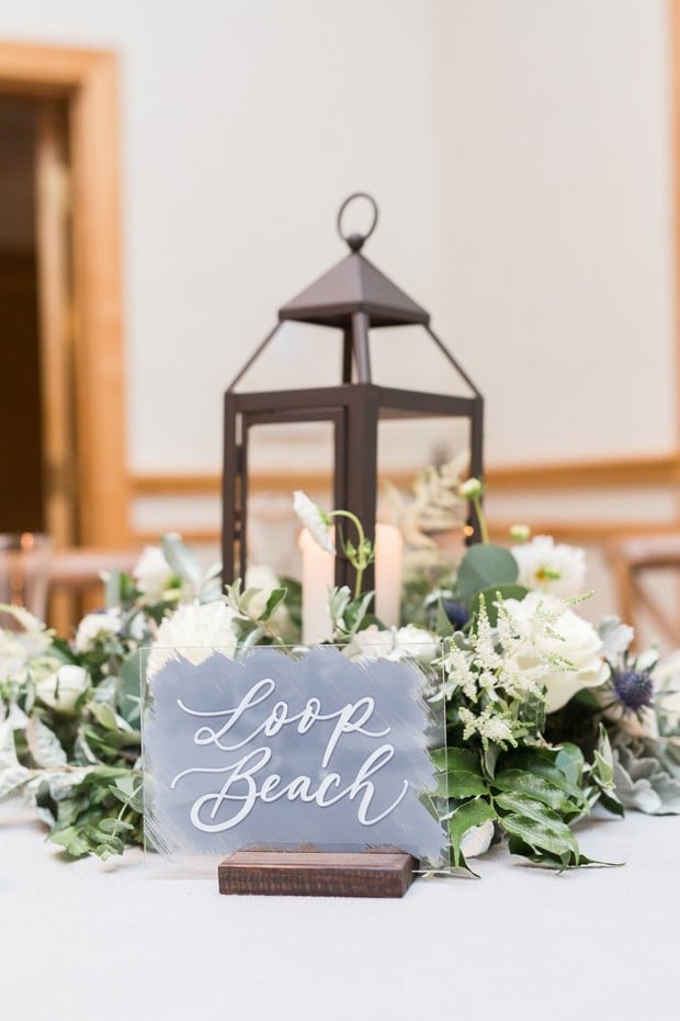 wedding table name with lantern centerpiece