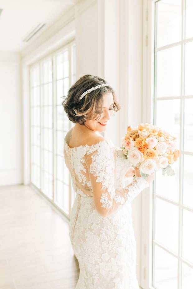 bride in pretty lace wedding dress