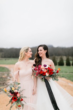 bride and bridesmaid in soft blush dress