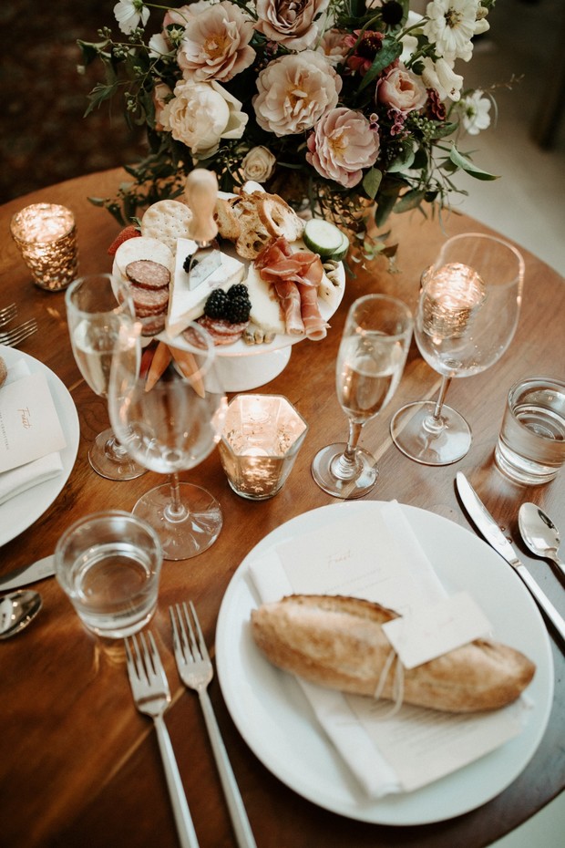 sweetheart table with mini charcuterie board and baguette place cards