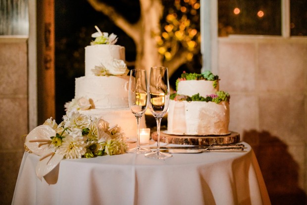 elegant white and flower topped wedding cakes