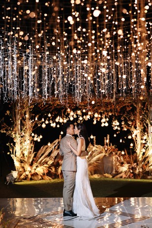 dreamy first dance dripping in hanging lights