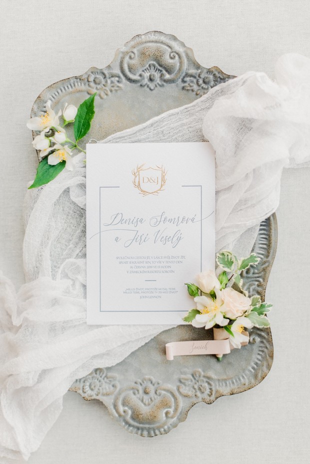 Elegant wedding invitation on a decorative silver tray