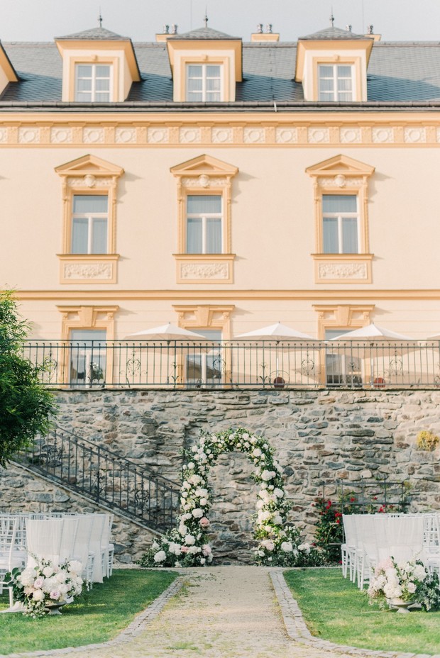 Beautiful wedding ceremony setup with floral archway