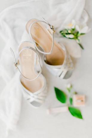 Elegant silver wedding shoes with delicate floral accents