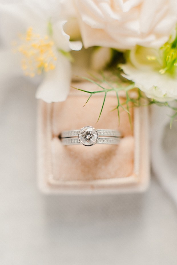 Elegant wedding ring set in a velvet box with flowers