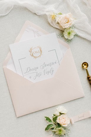 Elegant wedding invitation in a light pink envelope