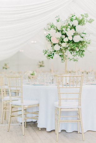 gold and white tented wedding reception
