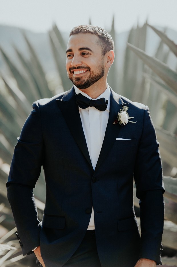 groom in navy blue suite