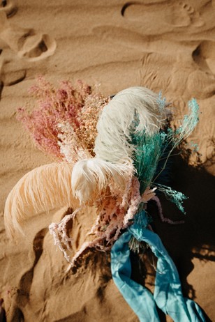 romantic ostrich feather and dried floral wedding bouquet