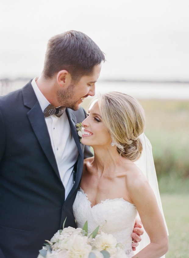 Happy bride and groom gaze at each other on wedding day