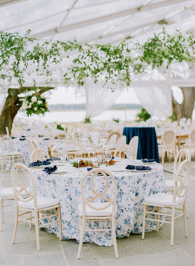 Elegant tented wedding reception with floral decor