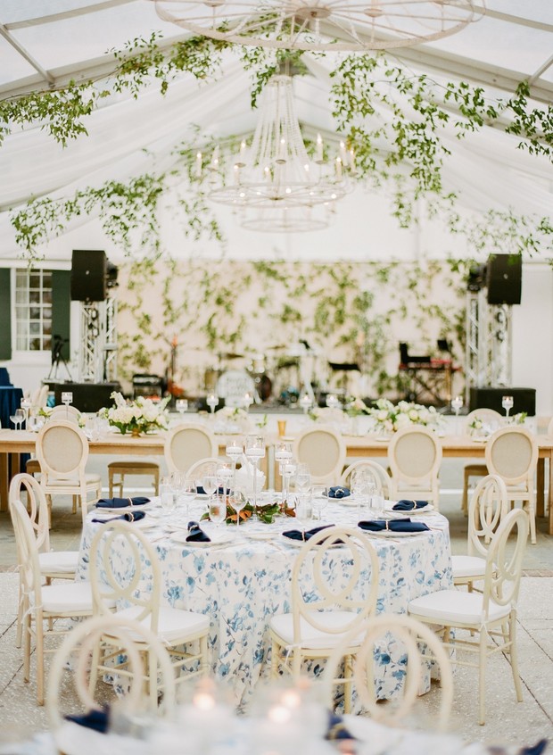 Elegant wedding reception tent with floral decorations
