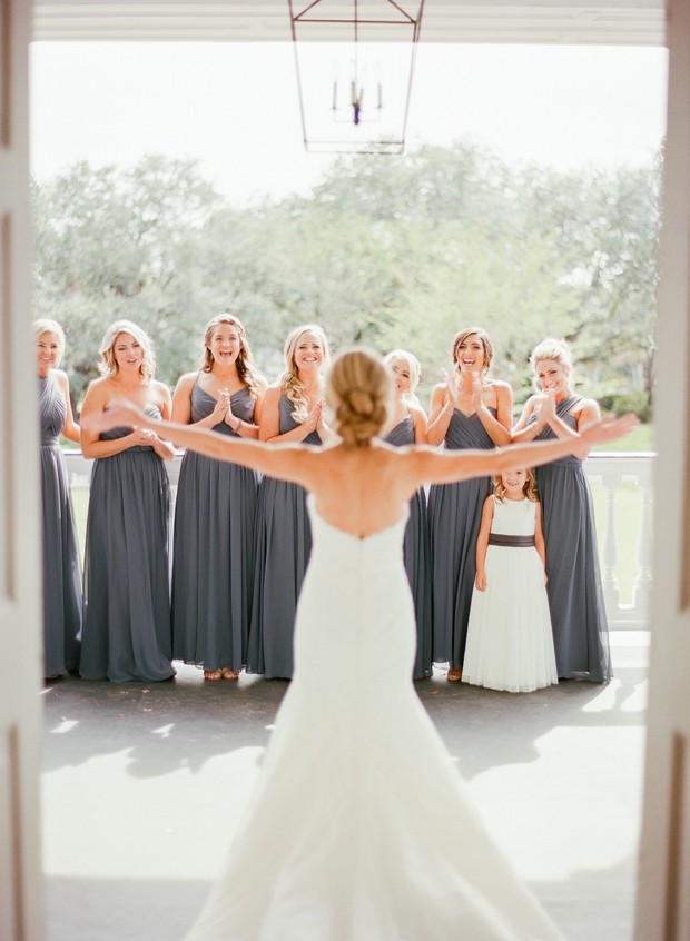 bride first look with bridesmaids