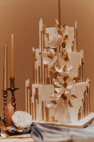 art deco wedding cake in gold and white