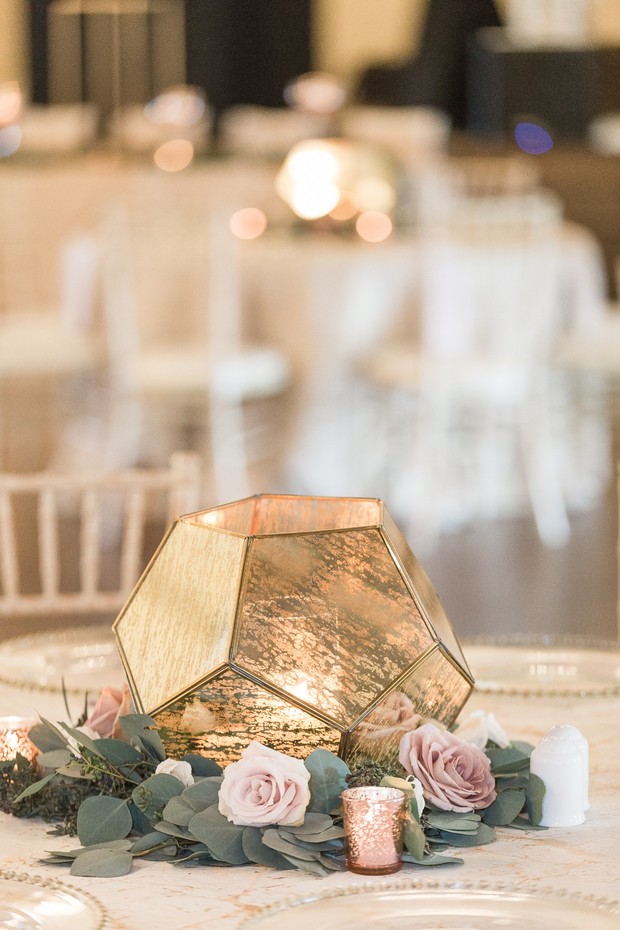 gold candle lit wedding centerpiece idea