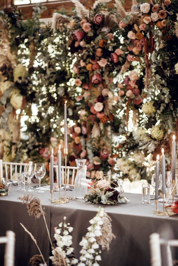wedding reception with flower backdrop