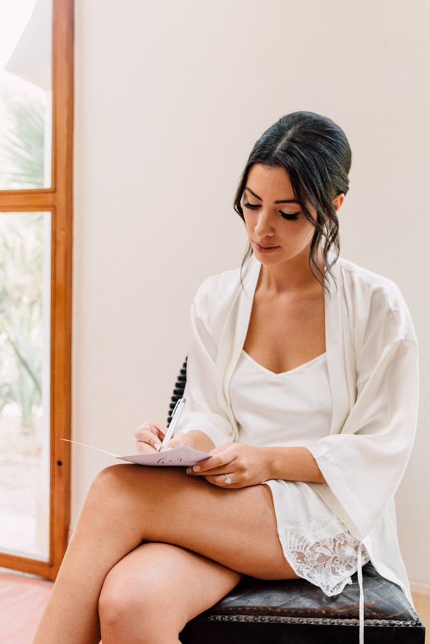 bride writing out her vows