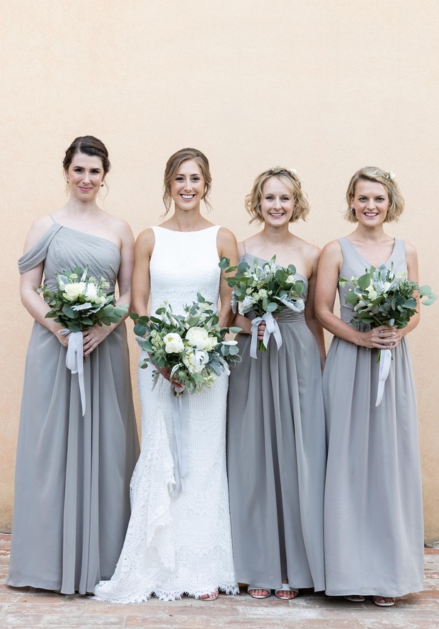 bride and her bridesmaids in soft gray