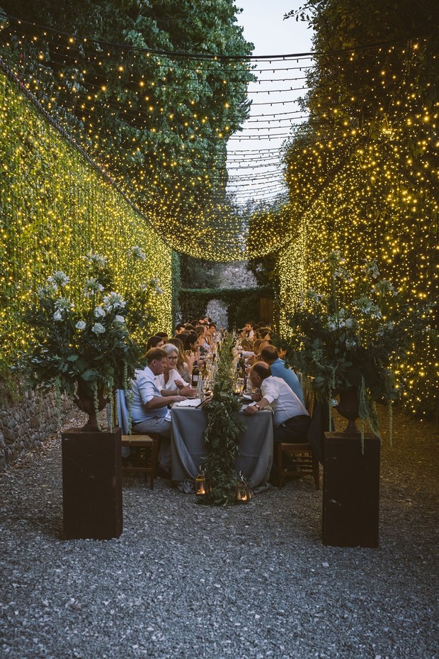 a tunnel of fairy lights wedding reception in Tuscany