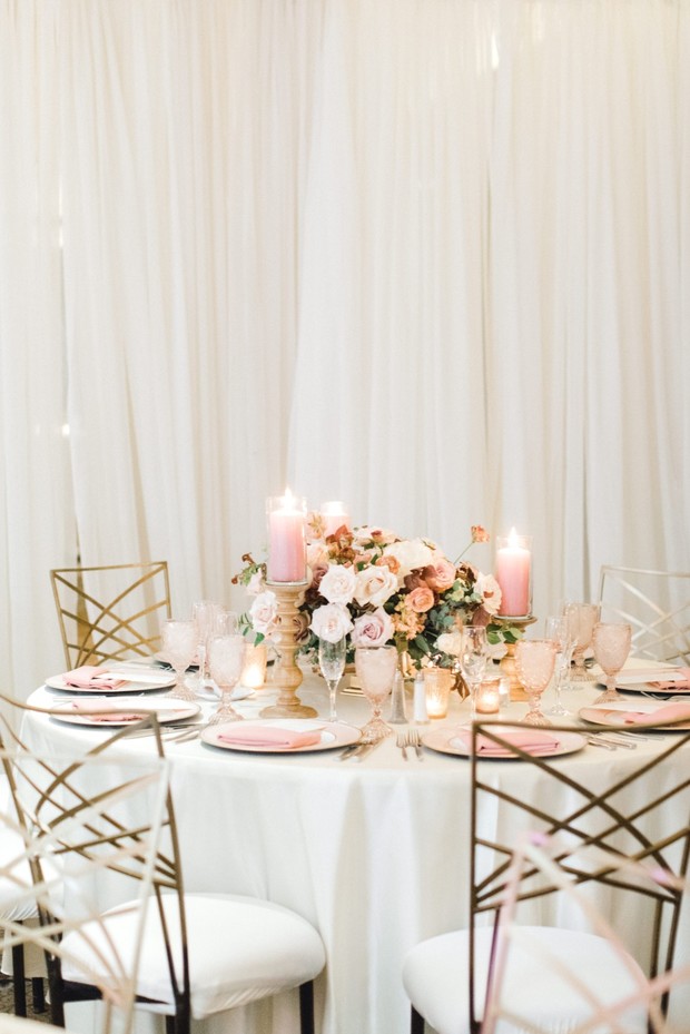 Elegant wedding table setting with pink floral centerpiece