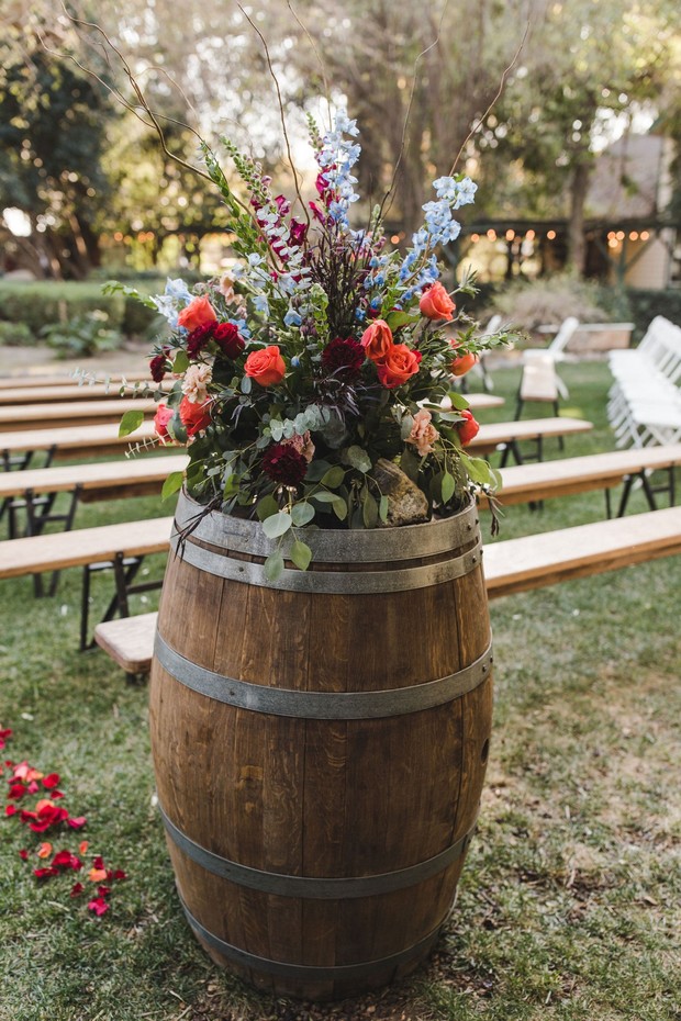 wedding floral decor and wine barrel