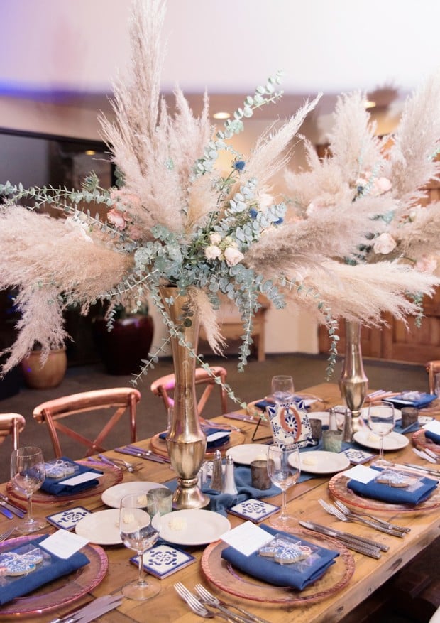 desert themed blue and popper boho wedding reception table