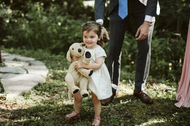 flower girl and stuffed dog toy