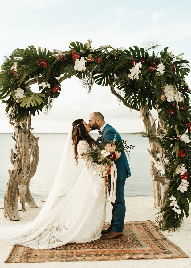 driftwood and tropical floral wedding arch