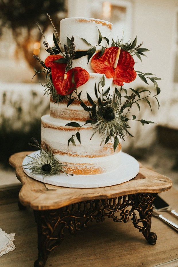 nearly naked cake topped with flowers