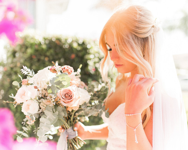 bridal half up hair and blush bouquet