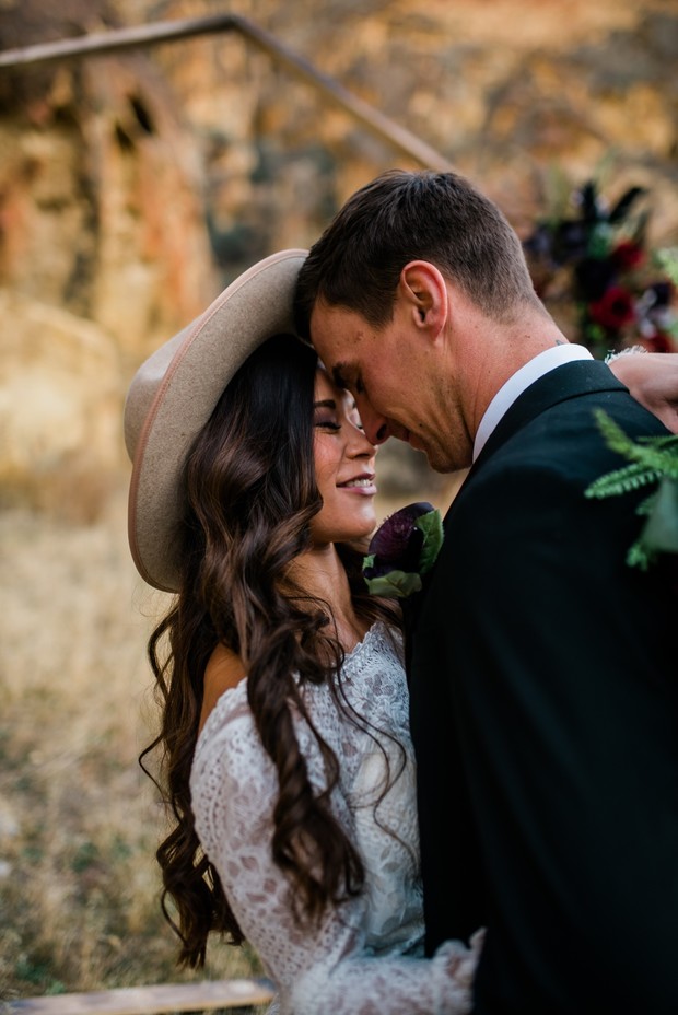 Bride and groom embrace lovingly on their wedding day