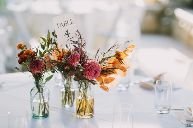 bud vases and table number centerpiece idea