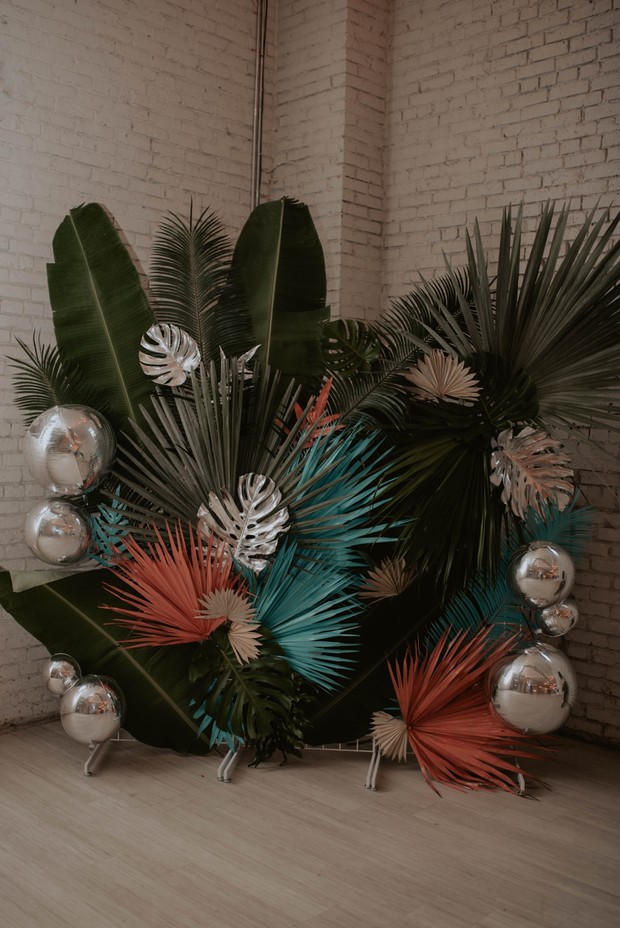 ceremony backrdrop with tropical leaves
